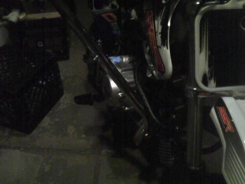 2003 Ford Crown Victoria - Close-up view of a motorcycle's engine and frame, with a watermark visible at the bottom right.