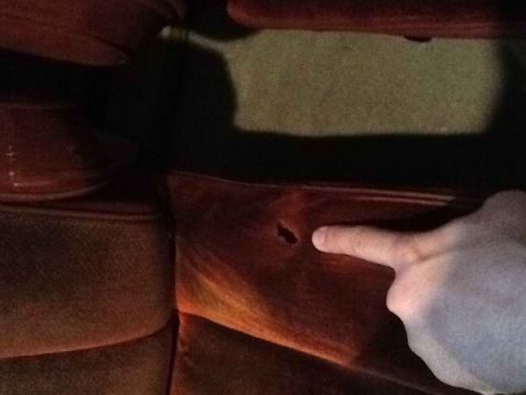 1985 Ford Bronco - Damage to the interior seat upholstery is visible in this close-up shot.