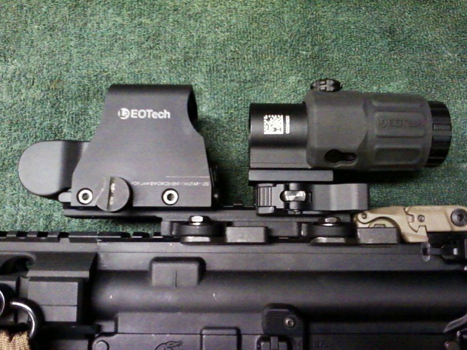 EOTech holographic sight and magnifier mounted on a rifle rail