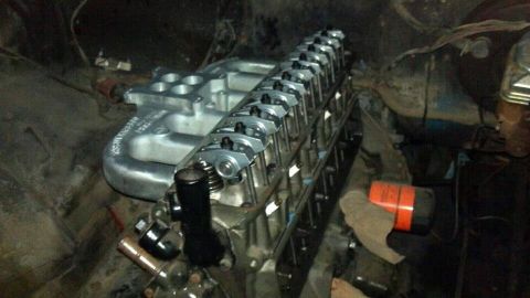 1978 Ford Bronco - Close-up view of an engine block, intake manifold, and valve train assembly.