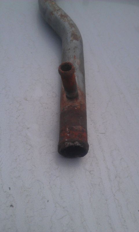 1991 Ford Festiva - A corroded radiator hose is shown against a neutral background.