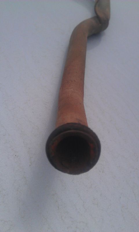 1991 Ford Festiva - This is a rusty exhaust pipe, likely from a vehicle.