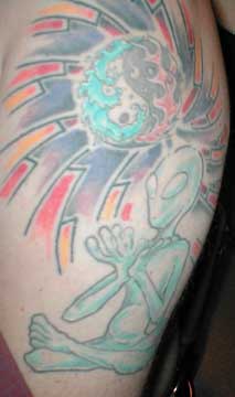 1994 Ford Crown Victoria - Tattoo art an alien figure and a yin-yang symbol with radiating colors.