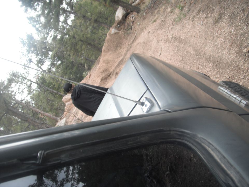 Gray SUV's roof and antenna, 1990 Ford Bronco