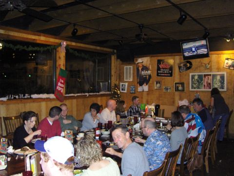 2007 Ford Mustang - A group of people are dining in a restaurant during the Christmas season.