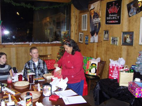 2007 Ford Mustang - A holiday gathering with people, presents, and festive decor is underway.