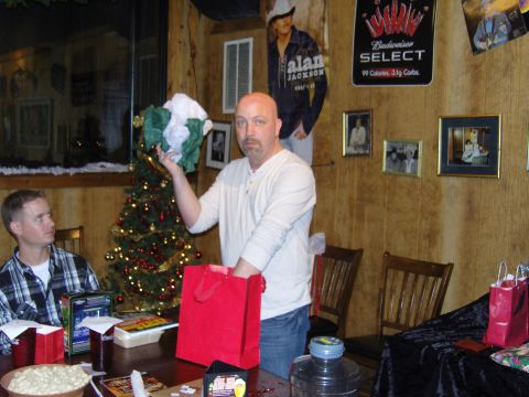 2007 Ford Mustang - People gathered around a table with gifts and a Christmas tree.