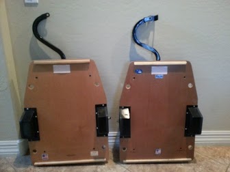 1978 Ford Bronco - Two car seats are shown from the rear, each with a wooden base and black metal handles.