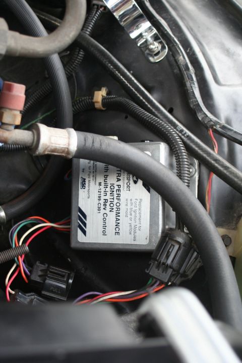 1976 Ford Ranchero - Close-up of an aftermarket ignition control module and wiring in an engine bay.