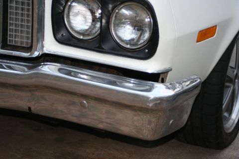 1976 Ford Ranchero - This vehicle features a chrome bumper and dual headlights, with a distinctive grille pattern.
