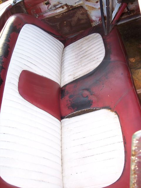 1956 Ford Thunderbird - Interior view of a 1956 Ford Thunderbird, highlighting its distinctive red and white seating.
