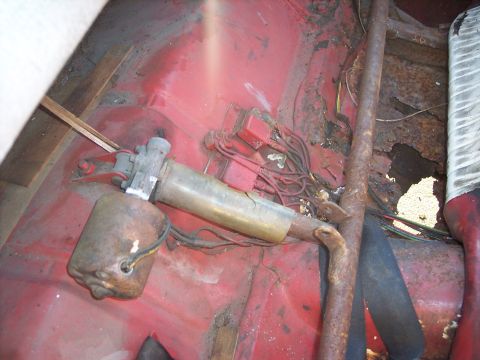 1956 Ford Thunderbird - The interior of this vehicle shows significant rust on the floor pan, along with a visible fuel pump and associated wiring.
