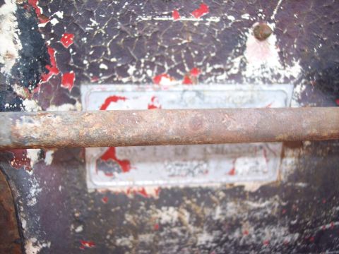 1956 Ford Thunderbird - A close-up of a weathered vehicle identification plate, showing signs of age and wear.