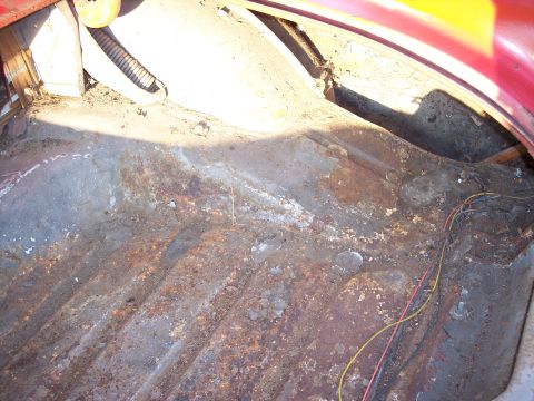 1956 Ford Thunderbird - The trunk floor shows significant rust and wear, with some electrical wiring visible.