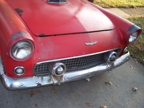 1956 Ford Thunderbird - Front view of a red 1956 Ford Thunderbird showing its distinctive grille and headlights.