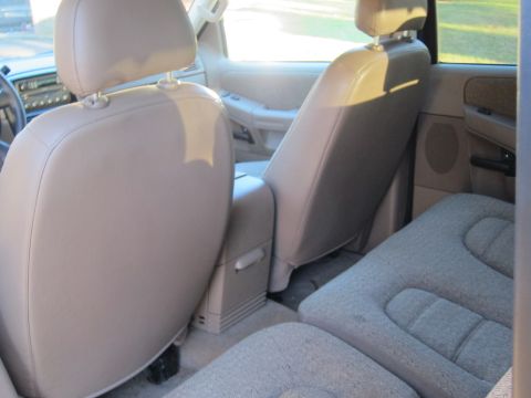 1991 Ford LTD Crown Victoria - Interior of a 2005 Ford Explorer, showing the front and rear seating areas and center console.