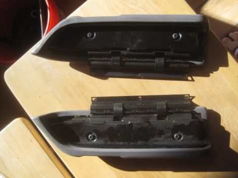 1993 Ford Bronco - Two interior door armrests are shown, likely for a Ford Bronco, with visible hardware and mounting points.