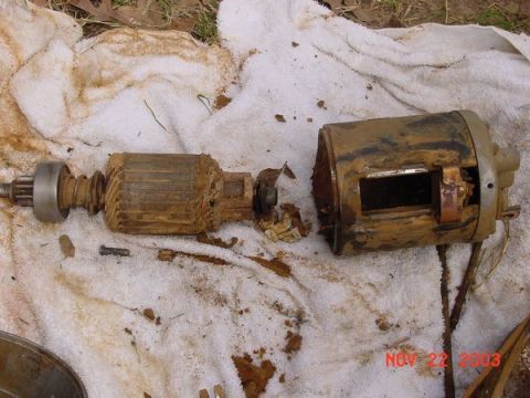 1989 Ford Bronco - Starter motor disassembled and covered in dirt, photographed on November 22, 2003.