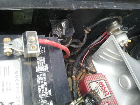 1986 Ford Bronco - Close-up view of a vehicle's battery and ignition system components, including an MSD ignition box.