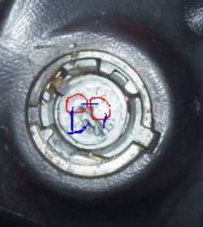 1995 Ford F-150 - A close-up view of a bolt head with markings and the SuperMotors.net logo visible.