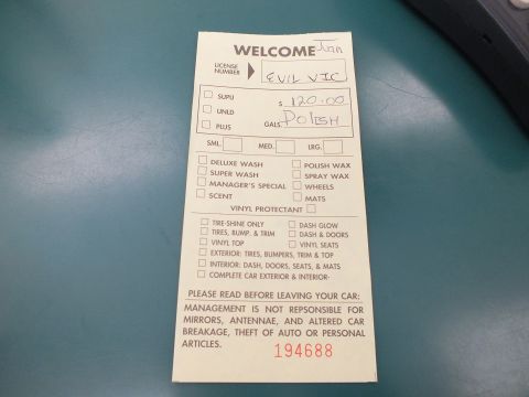 2003 Ford Crown Victoria - car-wash service welcome ticket with checkboxes and a handwritten price, not a vehicle technical document.