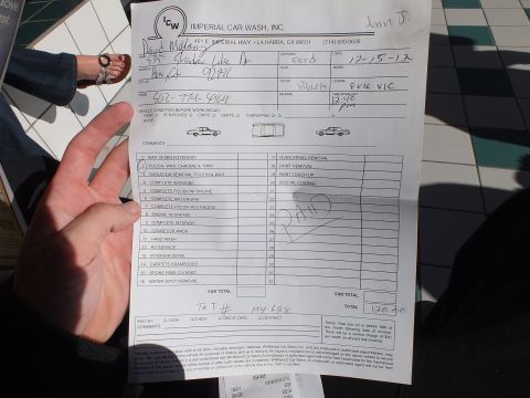 2003 Ford Crown Victoria - Photo of a handwritten car-wash detailing work order/invoice listing services and a $120.00 total, not a technical document.