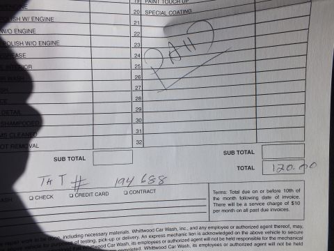 2003 Ford Crown Victoria - Photo of the lower portion of a car-wash service checklist invoice showing subtotal and $120.00 total, not a technical document.