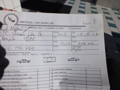 2003 Ford Crown Victoria - Photo of an Imperial Car Wash work-order form with handwritten Ford vehicle details and service checklist, not a technical document.