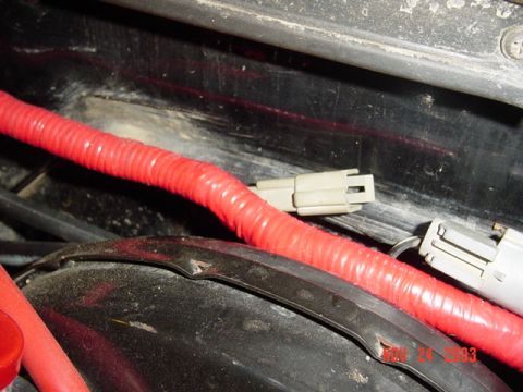 1989 Ford Bronco - Close-up of a red-wrapped wiring harness with gray connectors, showing a date stamp of NOV 24 2003.