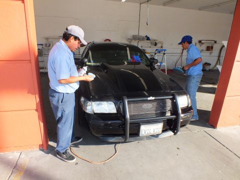 2003 Ford Crown Victoria - Worker details a black Crown Victoria fitted with a grille guard and EVIL VIC plate.