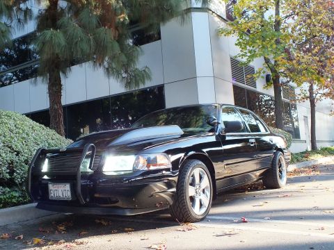 2003 Ford Crown Victoria - Black Crown Victoria front quarter, cowl hood and brush guard, chrome wheels, EVIL VIC plate by building.