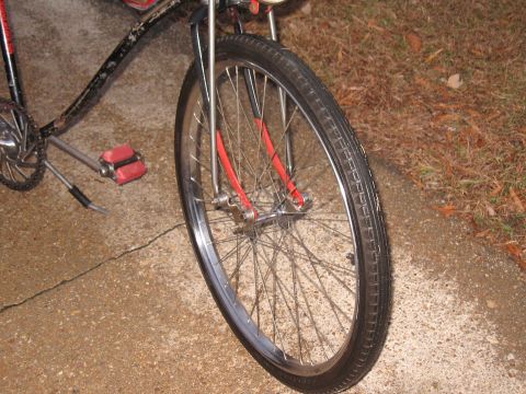 1994 Ford Bronco - Close-up of a bicycle's front wheel, pedals, and part of the frame.