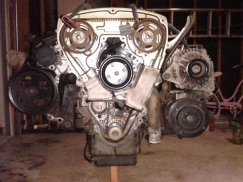 1992 Ford Taurus - This engine assembly features exposed timing gears and various engine components, suggesting it's out of a vehicle.