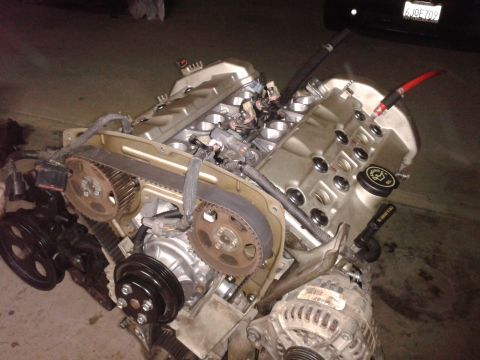 1992 Ford Taurus - Engine assembly with visible timing belt, pulleys, and alternator.