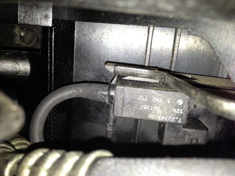1999 BMW 5 Series - This image shows a close-up of a BMW electronic component, likely a sensor or valve, with visible part numbers and the BMW logo.