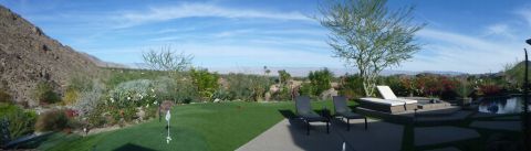 1997 Ford Ranger - A backyard oasis a pool, lounge chairs, and a putting green with a scenic mountain view.
