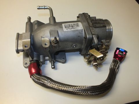 2003 Ford Crown Victoria - Throttle-body intake elbow on a table, vapor port up top, braided -AN line with red and blue fittings.