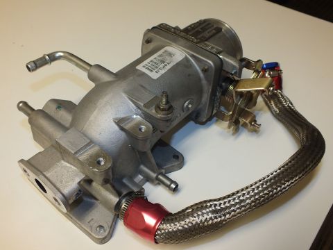 2003 Ford Crown Victoria - Lower view of the cast intake elbow showing mounting flange, throttle linkage and braided -AN hose.