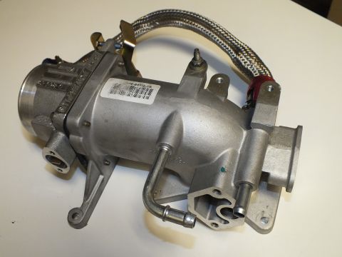 2003 Ford Crown Victoria - Angled view of the aluminum intake elbow showing the throttle bore, cast ports, label and braided hose.