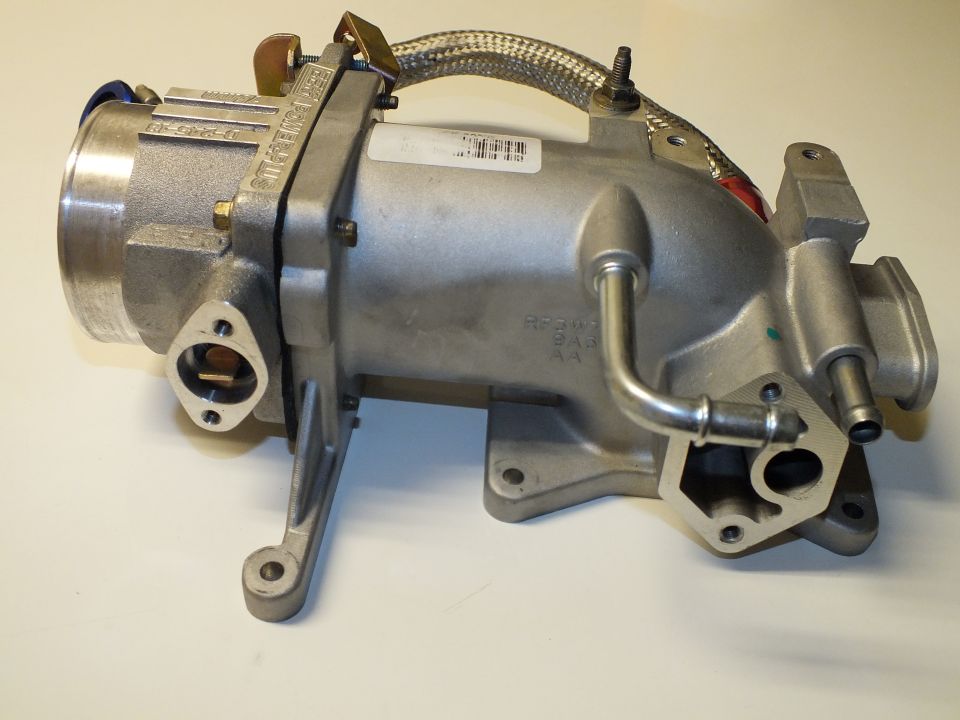 Aluminum intake manifold and throttle body assembly with braided line
