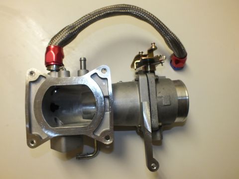 2003 Ford Crown Victoria - Aluminum intake elbow showing a rectangular flange opening, throttle linkage and a braided hose with anodized fittings.