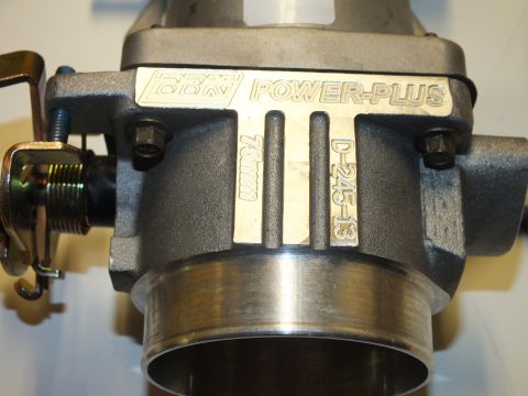 2003 Ford Crown Victoria - Detail of a BBK Power-Plus throttle body casting engraved 75mm and D-245-13 with throttle linkage at left.