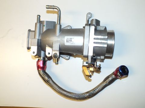 2003 Ford Crown Victoria - Throttle body and intake casting joined by a steel-braided line with anodized AN end fittings on a dark surface
