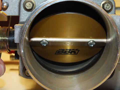 2003 Ford Crown Victoria - Closeup of the BBK throttle blade and shaft assembly seated inside the cast aluminum throttle body bore
