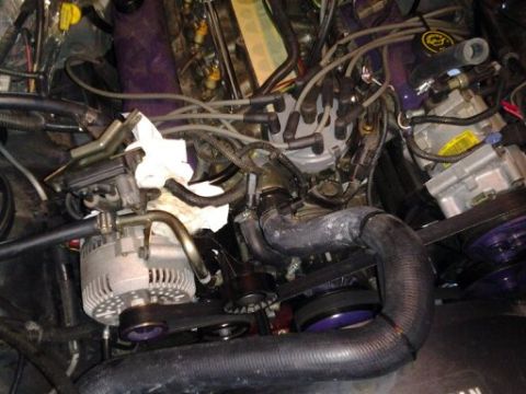 1996 Ford Bronco - Close-up view of a vehicle's engine bay, showing various components and wiring.