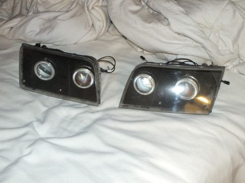 2003 Ford Crown Victoria - Matched custom headlamp pair with twin projectors and halo accent rings.
