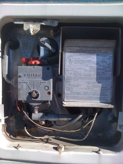 1986 Yugo GV - Close-up of a water heater control unit, showing its internal components and labeling.