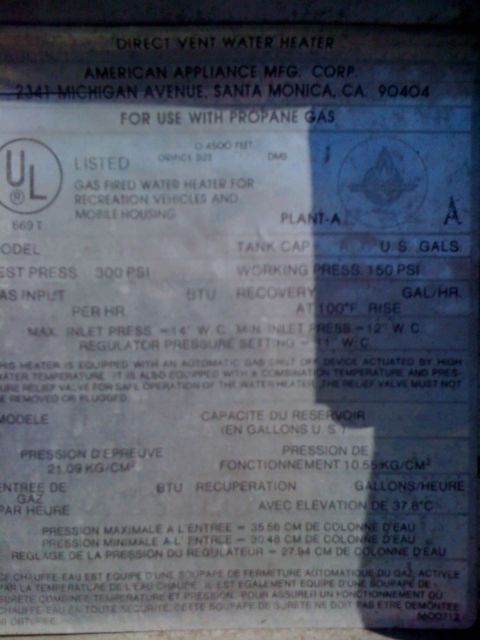 1986 Yugo GV - Label details a direct vent water heater for propane gas, manufactured by American Appliance Mfg. Corp.