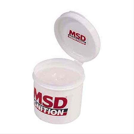 1990 Ford Bronco - A white container with the MSD Ignition logo is shown, with its lid open.