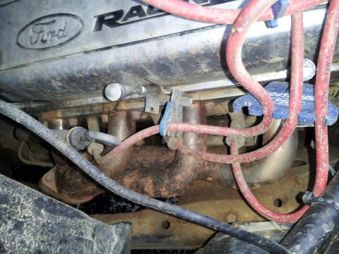 1986 Ford Bronco - Close-up view of a Ford engine's spark plug wires and manifold.